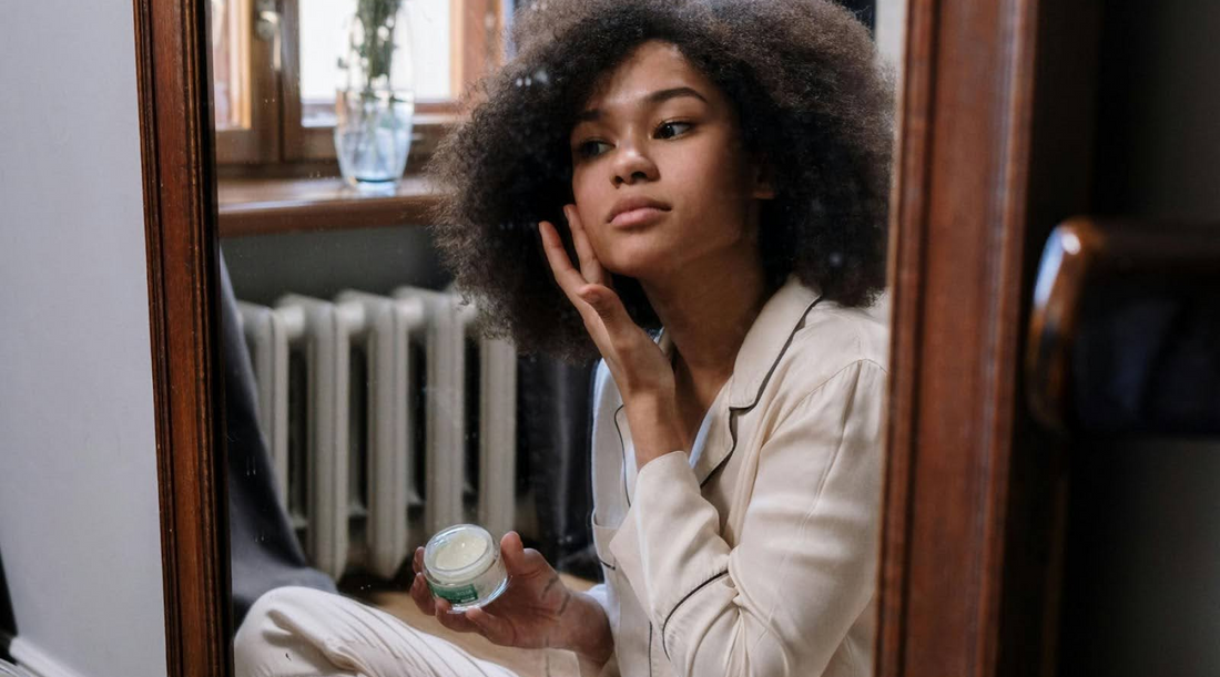 Woman Applying Moisturizer