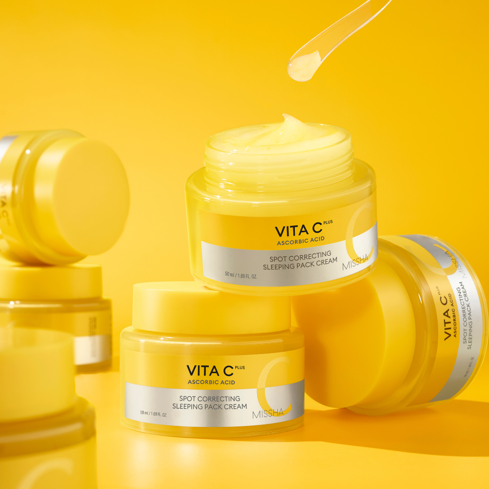 Yellow jars of Vita C skincare cream on a yellow background Yellow jars of Vita C skincare cream on a yellow background