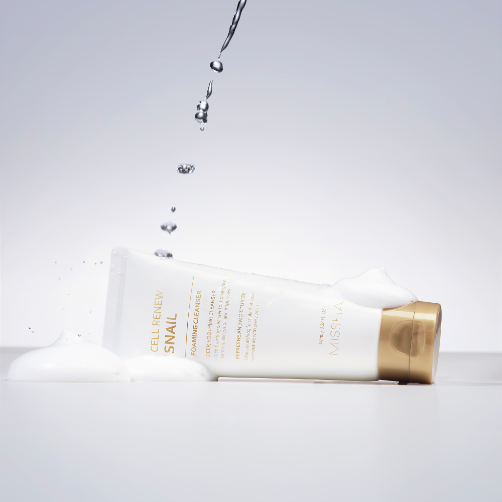 A tube of Missha Cell Renew Snail Foaming Cleanser dripping with water A tube of Missha Cell Renew Snail Foaming Cleanser dripping with water