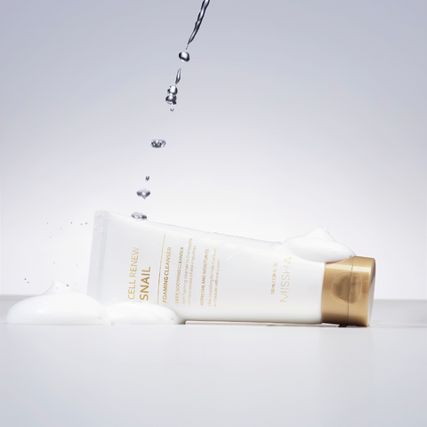 A tube of Missha Cell Renew Snail Foaming Cleanser dripping with water A tube of Missha Cell Renew Snail Foaming Cleanser dripping with water