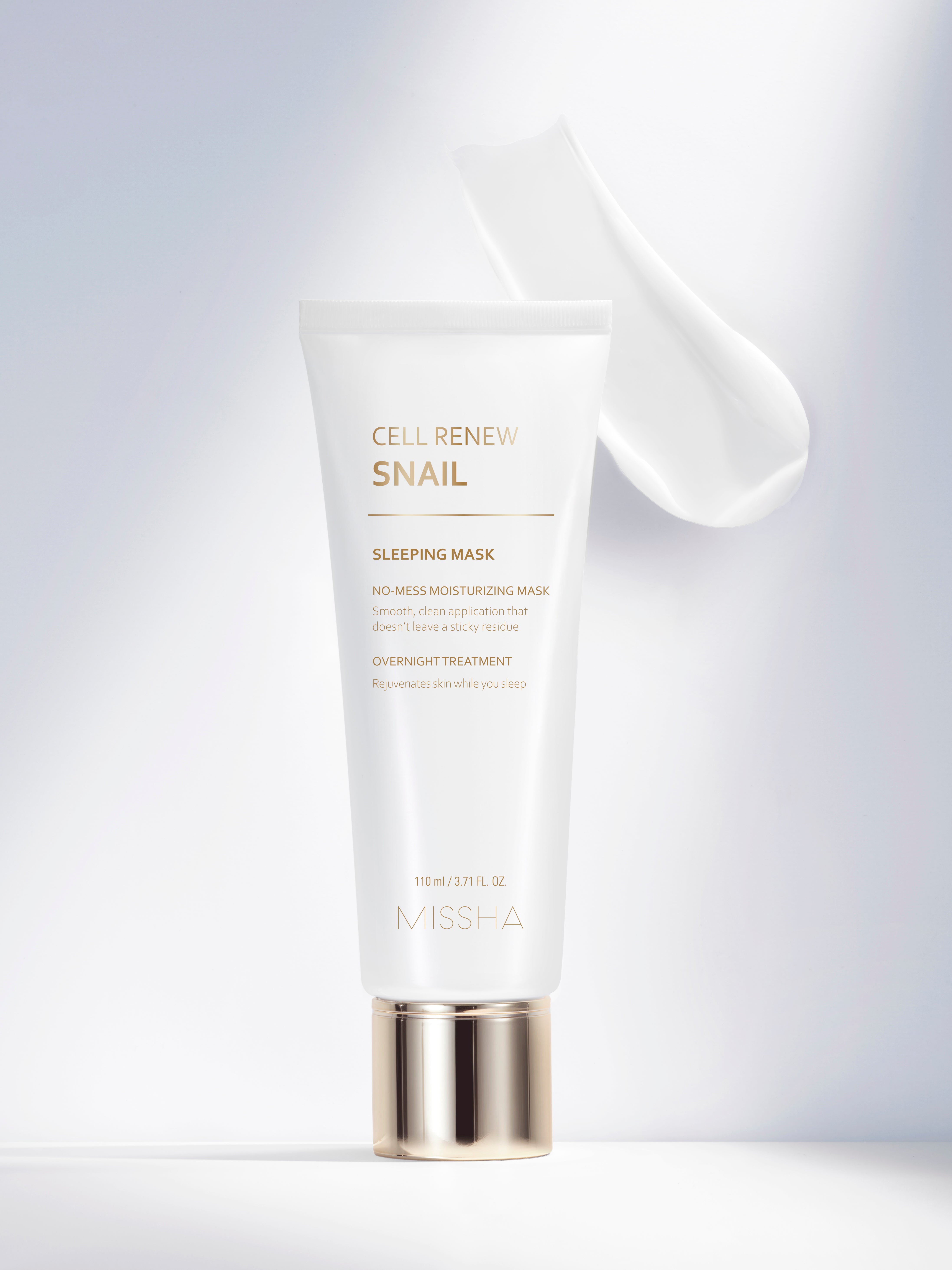 A tube of Missha Cell Renew Snail Sleeping Mask with white and gold packaging and a swatch. A tube of Missha Cell Renew Snail Sleeping Mask with white and gold packaging and a swatch.