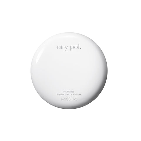 Top-down view of the closed, smooth, white circular compact for the Missha Airy Pot Pressed Powder Pact. The image clearly features the 'airy pot.' logo and 'MISSHA', emphasizing the simple, clean design of the oil-control pressed powder. Top-down view of the closed, smooth, white circular compact for the Missha Airy Pot Pressed Powder Pact. The image clearly features the 'airy pot.' logo and 'MISSHA', emphasizing the simple, clean design of the oil-control pressed powder.