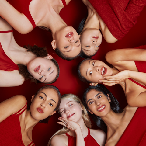 MISSHA Perfect Cover BB Cream campaign featuring diverse models in red outfits holding BB Cream tubes against a red background, highlighting flawless and radiant skin coverage MISSHA Perfect Cover BB Cream campaign featuring diverse models in red outfits holding BB Cream tubes against a red background, highlighting flawless and radiant skin coverage