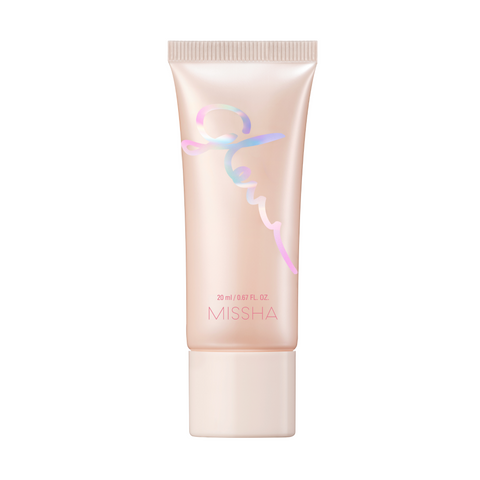A closed container of Missha Glow Skin Balm with a pink and silver color scheme. A closed container of Missha Glow Skin Balm with a pink and silver color scheme.