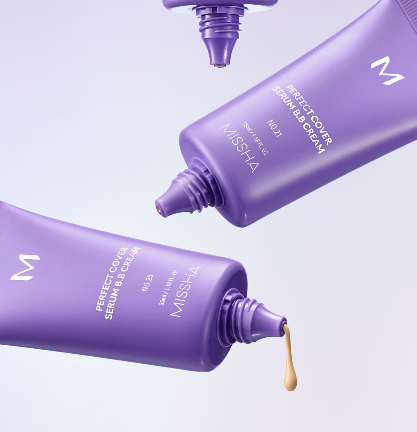 Three purple tubes of Missha Perfect Cover Serum B.B. Cream float in the air, with a drop of product coming from one. Three purple tubes of Missha Perfect Cover Serum B.B. Cream float in the air, with a drop of product coming from one.