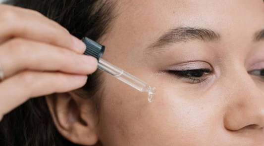 Woman Applying Serum to Face