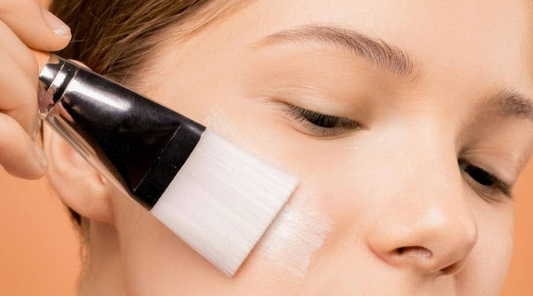 Woman Applying Moisturizer with Brush