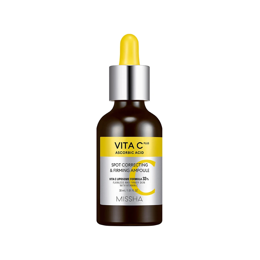 The dark amber glass dropper bottle of Missha Vita C Plus Spot Correcting & Firming Ampoule. This K-beauty serum contains Ascorbic Acid (Vitamin C) for brightening dark spots, promoting an even skin tone, and providing a firming effect.