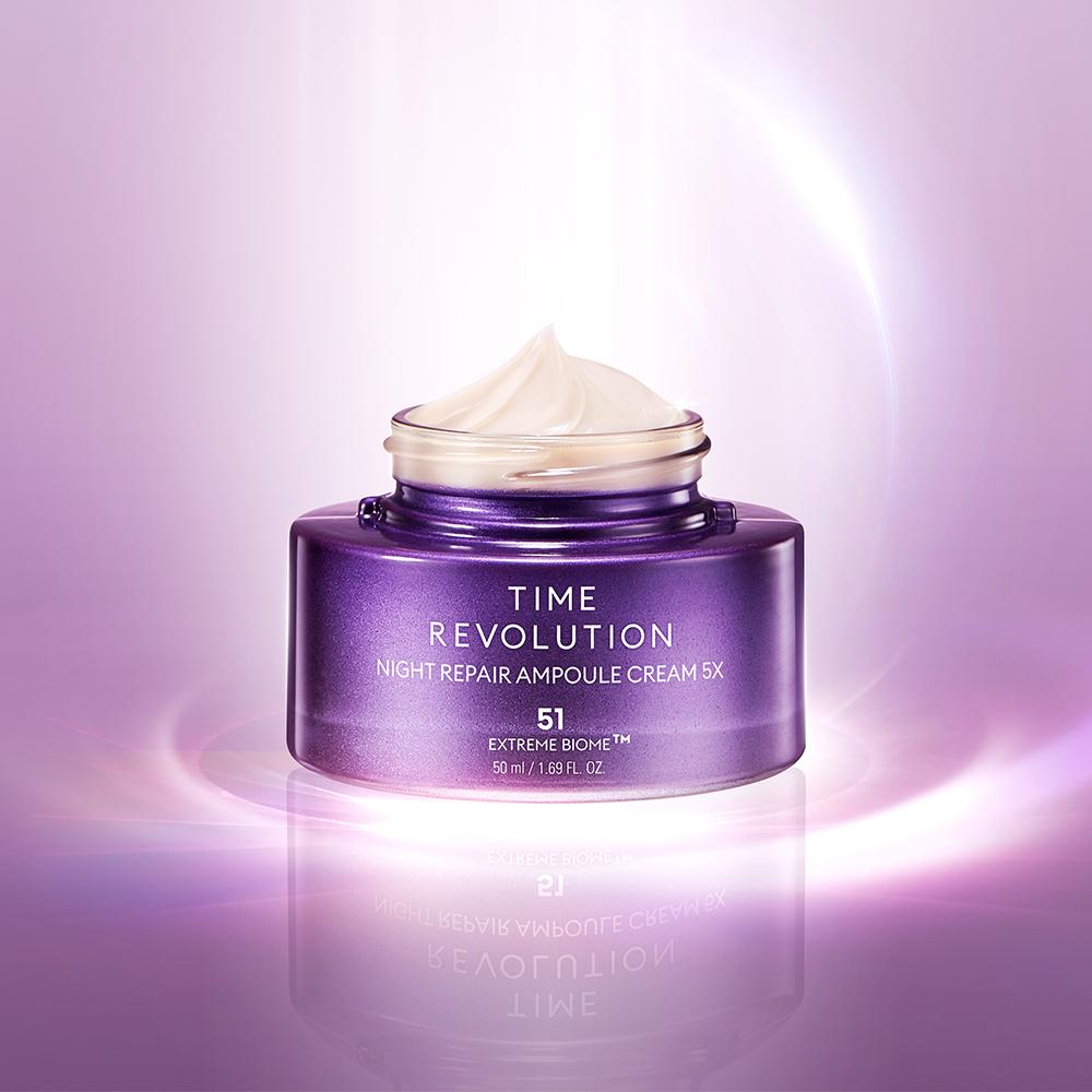 MISSHA Time Revolution Night Repair Ampoule Cream 5X in a luxurious purple jar with a swirl of creamy texture on top, illuminated by a soft violet glow on a radiant gradient background.