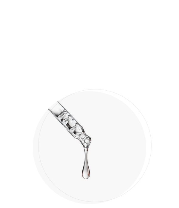 A drop of liquid is poised at the tip of a dropper, ready to fall against a minimalist white background.