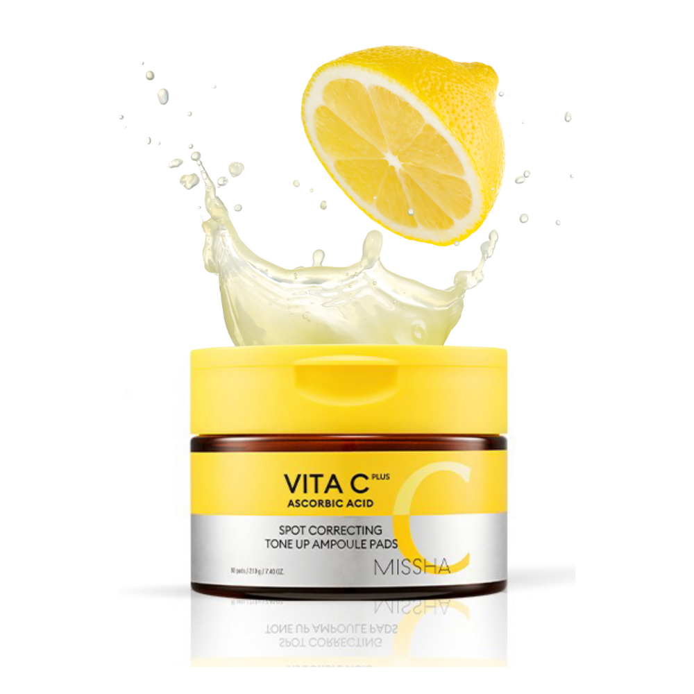 A container of MISSHA Vita C Plus Spot Correcting Toner Pads with a lemon splash graphic, indicating the product's vitamin c content.