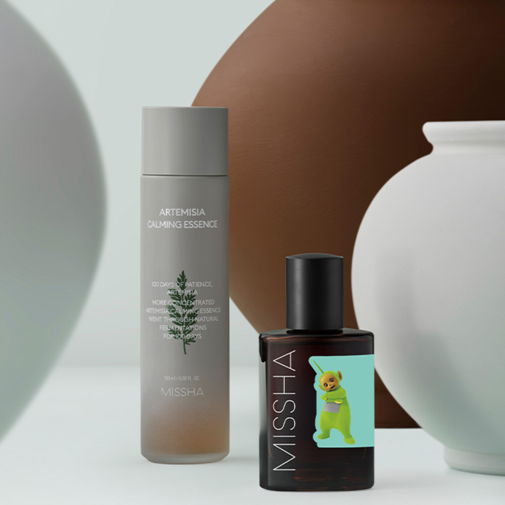 MISSHA Artemisia Calming Essence and Artemisia Calming Ampoule featuring a Teletubbies character on the label, displayed among minimalist ceramic vases.