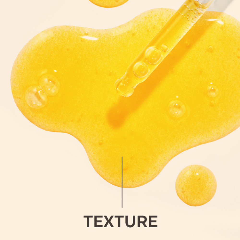 Close-up of yellow gel with a dropper labeled 'TEXTURE' on a beige background