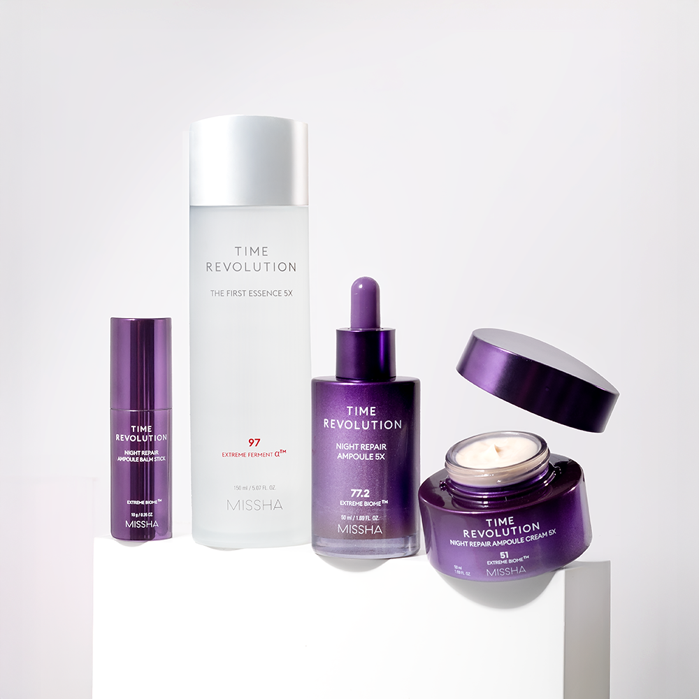 A collection of Missha skincare products including a toner, essence, serum, cream, and balm stick, all presented in purple and white packaging.
