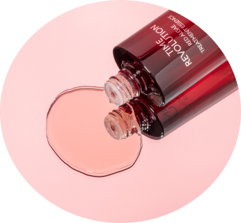 Time Revolution skincare products with red algae, artfully arranged on a soft pink background with coral accents.