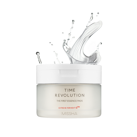 A jar of Missha Time Revolution The First Essence 5X Toner Pads with a dynamic splash effect on the label, indicating hydration and moisture.