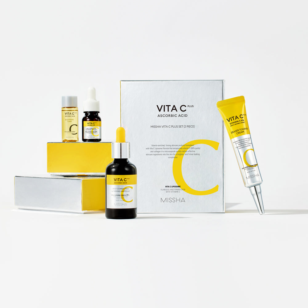 MISSHA Vita C Plus Skincare Set, containing a spot correcting ampoule, a eraser toning cream, and cotton pads, packaged in a yellow and white box.