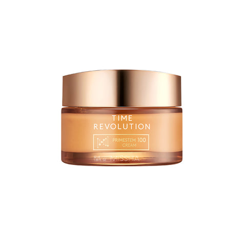 A gold and amber jar of the Time Revolution Prime Stem 100 Cream for K-beauty anti-aging. The rich moisturizing cream contains Primestem 100 and Angelica callus extract for a visible 3D-lifting effect to firm sagging skin.