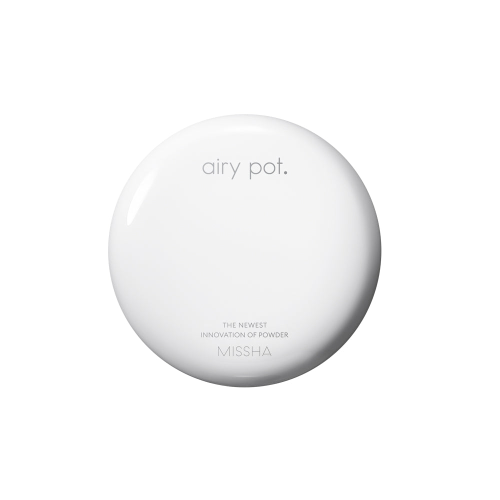 Top-down view of the closed, smooth, white circular compact for the Missha Airy Pot Pressed Powder Pact. The image clearly features the 'airy pot.' logo and 'MISSHA', emphasizing the simple, clean design of the oil-control pressed powder.