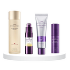 A set of four skincare products from Missha's Time Revolution Anti-Aging line displayed on a white platform. Products appear in a row, from left to right, starting with a golden bottle, followed by a purple tube, a white tube, and a purple stick.