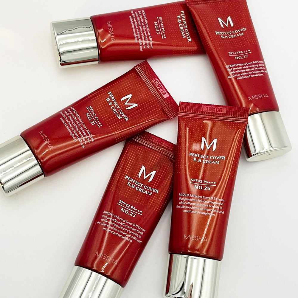 Five tubes of MISSHA M Perfect Cover BB Cream in red packaging with silver caps, arranged flat to display different shade numbers.