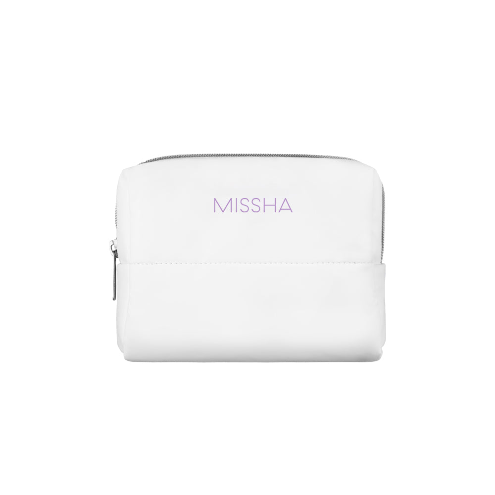 A white cosmetic pouch with the brand name 'MISSHA' embossed on the front.