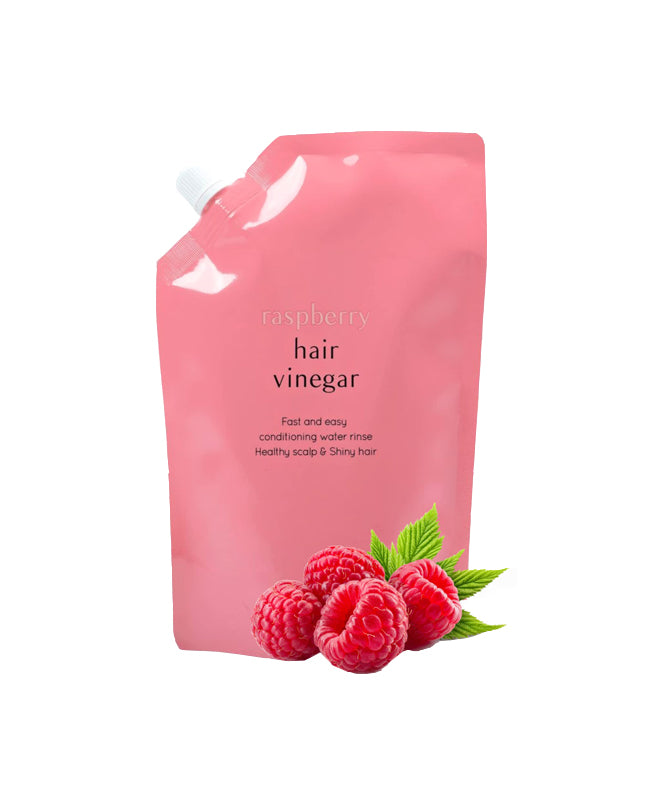 A'pieu Raspberry Hair Vinegar in a pink refill pack with an image of raspberries in front of the package.