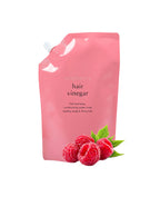 A'pieu Raspberry Hair Vinegar in a pink refill pack with an image of raspberries in front of the package.