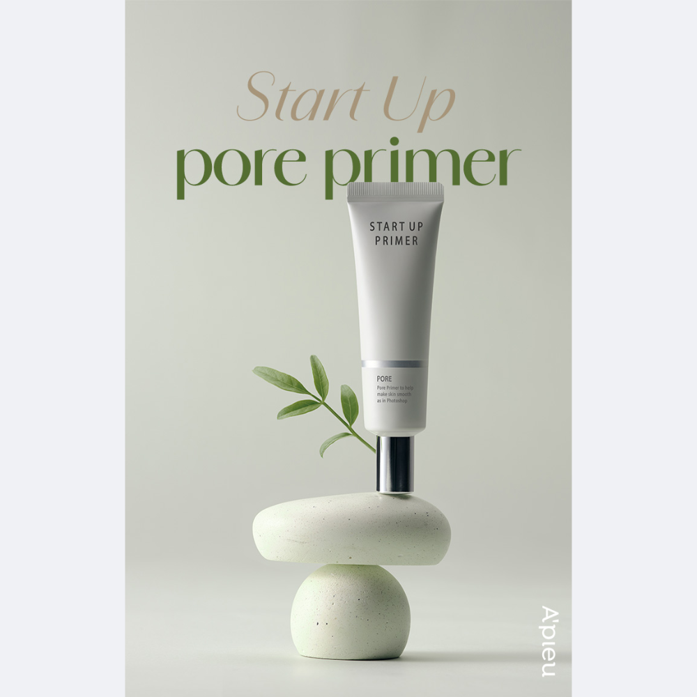 A'PIEU Start Up Pore Primer tube with beige colored cream coming out, indicating the product is a makeup primer.