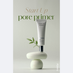 A'PIEU Start Up Pore Primer tube with beige colored cream coming out, indicating the product is a makeup primer.