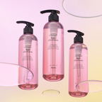 3 A'pieu Raspberry Vinegar Hair Shampoo in a clear pink bottles with a black pump.
