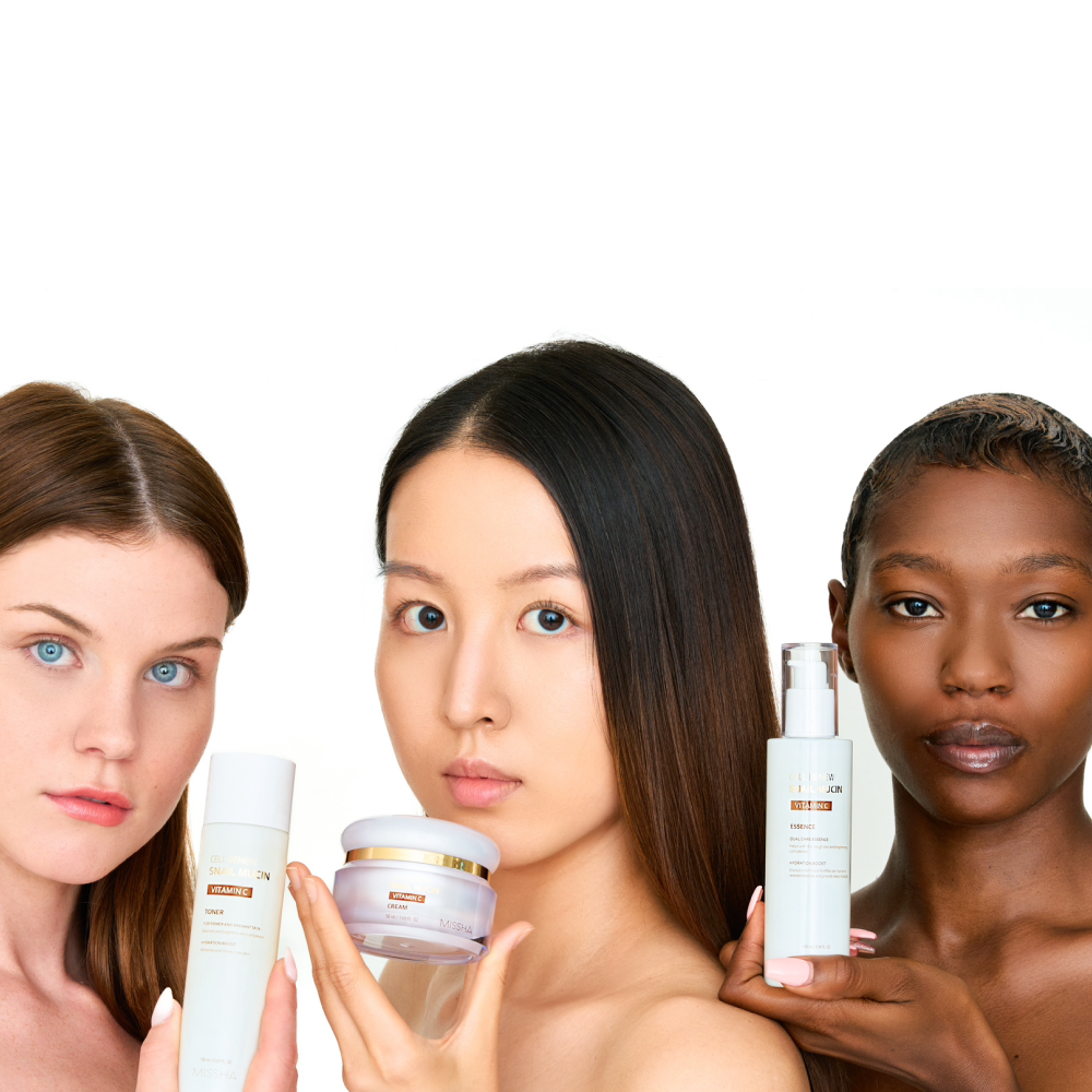 Three diverse models (White, Asian, and Black) holding the Missha Cell Renew Snail Mucin Vitamin C Toner, Cream, and Essence, promoting the complete line for firming, anti-wrinkle, and Korean beauty results.