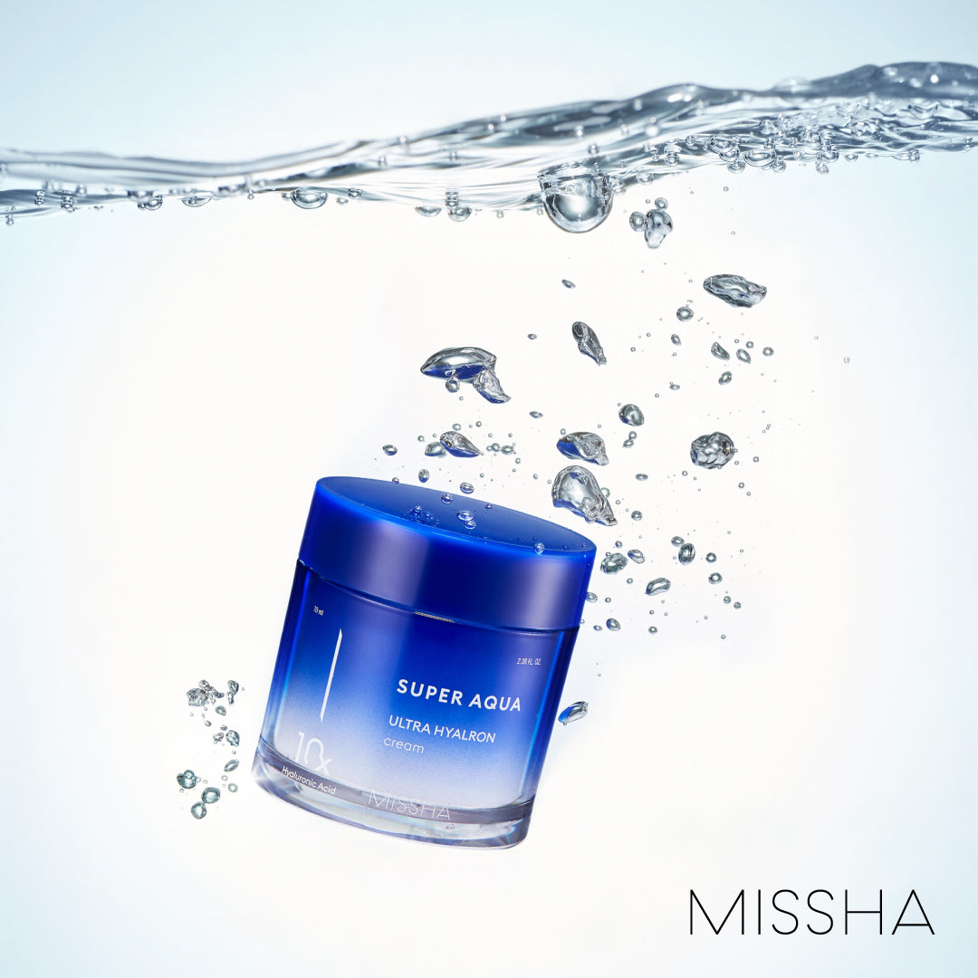 A jar of 'Super Aqua Ultra Hyalron Cream' by Missha, predominantly blue in color with white and grey text, indicating the product is a hydration cream designed to retain moisture in the skin.