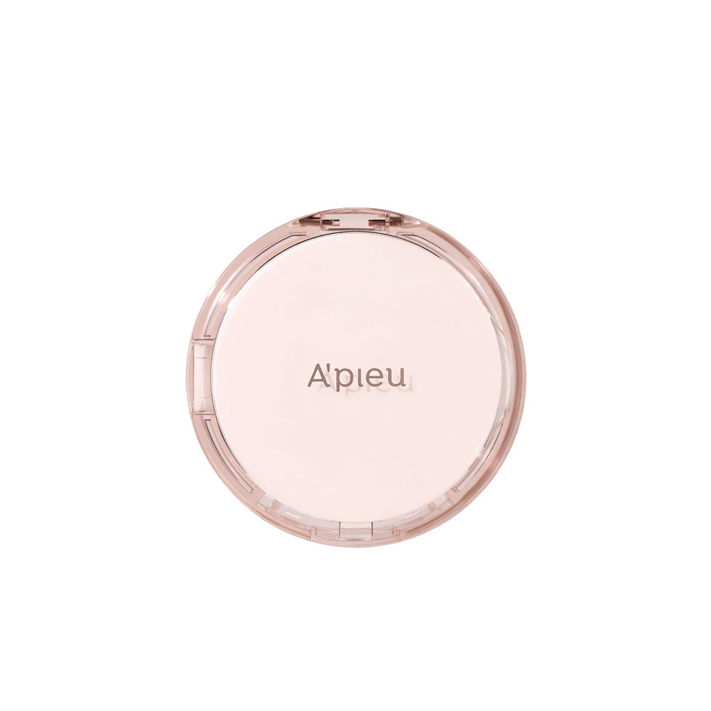 Studio shot of the closed A'pieu Cushion Foundation compact in a round, sheer pink case, ideal for natural skin tone and a dewy finish.