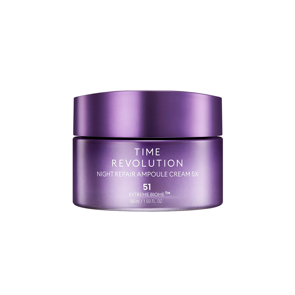 A jar of Time Revolution Night Repair Ampoule Cream 5X with a purple cap and label, indicating it is a skin care product designed for nighttime use.