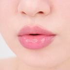 Close-up of glossy, hydrated lips with a natural pink finish, showcasing the smooth moisture effect of MISSHA lip care