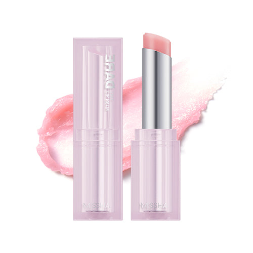 Three shades of Dare Tint Lip Balm by Missha, displayed horizontally. From left to right, the shades are Pink Chou, Dewy Berry, and Coral Look, with an open lip balm stick showing the product in use.