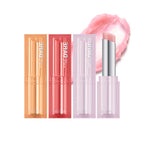 Three shades of Dare Tint Lip Balm by Missha, displayed horizontally. From left to right, the shades are Pink Chou, Dewy Berry, and Coral Look, with an open lip balm stick showing the product in use.