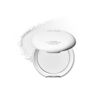 Missha Airy Pot. A compact white powder pact with a pressed powder formula, displayed against a white background. With a white trail of powder behind.