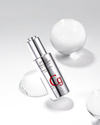 A silver ampoule labeled 'C9' from the Atelo Collagen brand, designed for skincare benefits, displayed with water droplets around it.