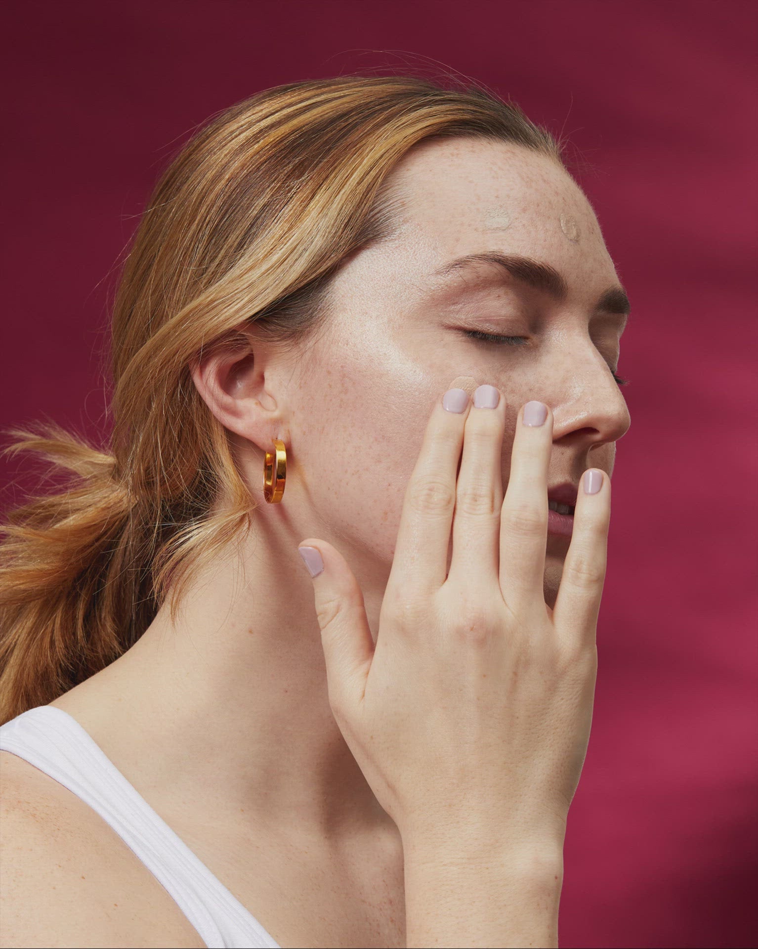 Person applying MISSHA M Perfect Cover BB Cream onto skin, showing smooth, natural coverage and even complexion