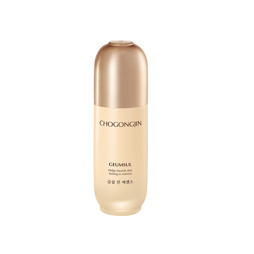 A bottle of Chogongjin Geumsul Jin Essence with a creamy beige liquid visible through a clear glass container with a gold-colored cap.
