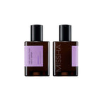 Two square, dark amber bottles of the Missha Time Revolution Night Repair Ampoule 5X with lilac labels and black caps. This shot shows the front and back of the K-beauty ferment-based ampoule packaging for powerful night repair.