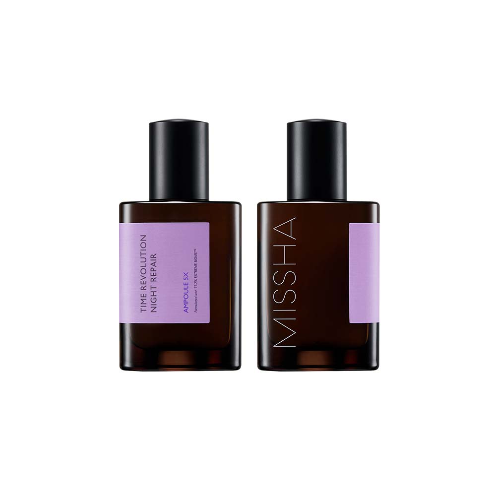 Two square, dark amber bottles of the Missha Time Revolution Night Repair Ampoule 5X with lilac labels and black caps. This shot shows the front and back of the K-beauty ferment-based ampoule packaging for powerful night repair.