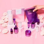 MISSHA Time Revolution skincare collection displayed on pink background with roses, featuring The First Essence, Night Repair Ampoule, Cream, and gift sets in signature purple and pearl packaging